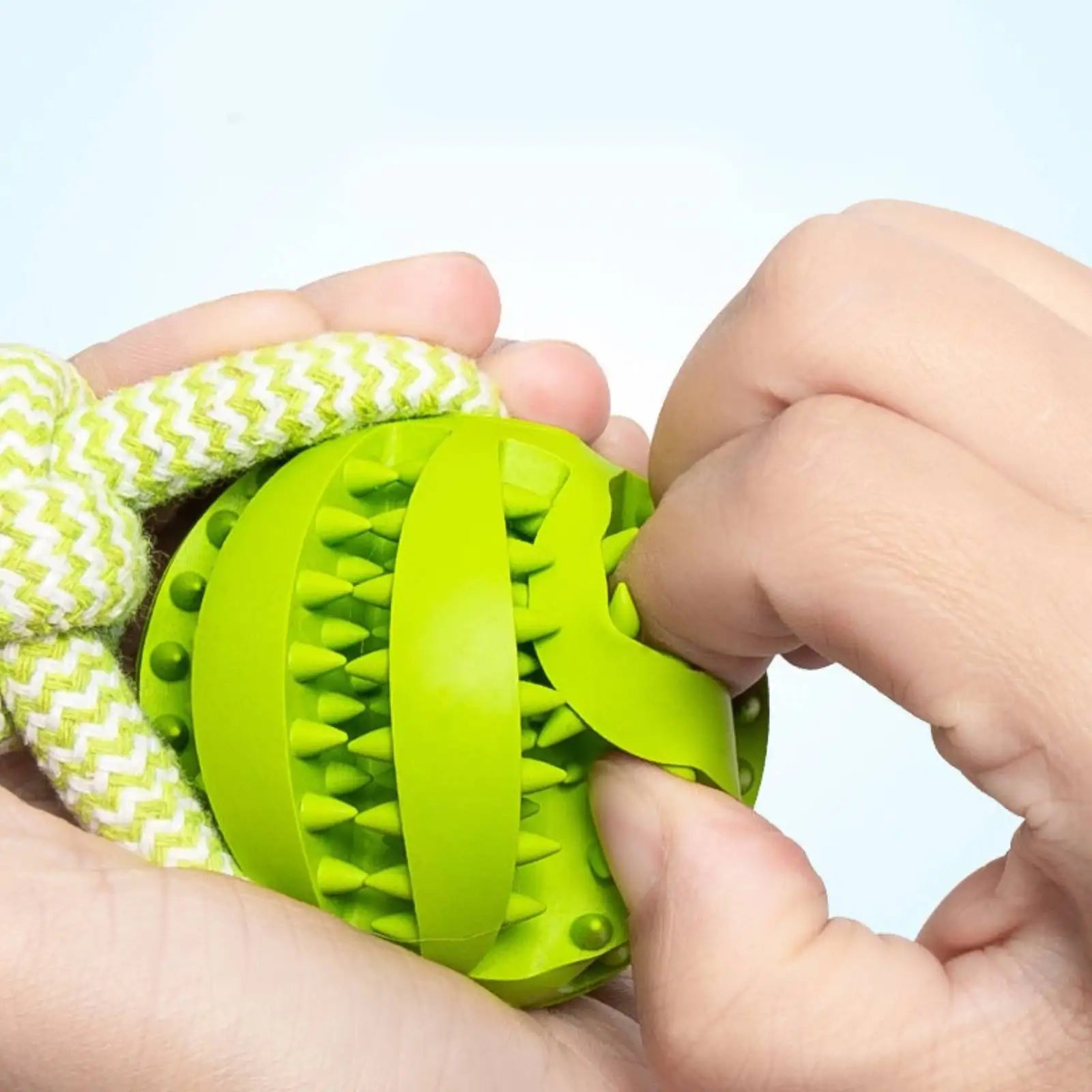 Dog Ball with Rope handle interactive toy with "leaking" treets to help clean teeth