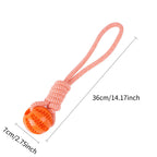 Dog Ball with Rope handle interactive toy with "leaking" treets to help clean teeth